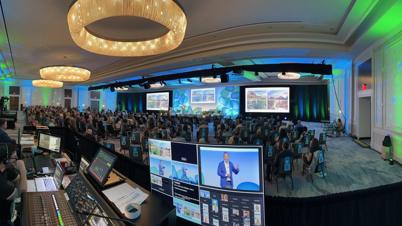 Wide panoramic view from production desk of elegant ballroom with chandeliers